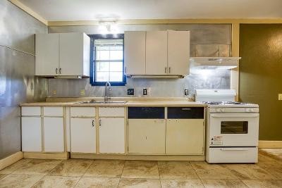 10733 Timbergrove Lane Corpus Christi, TX 78410 - Photo 31 of 40 a kitchen with granite countertop white cabinets and white appliances