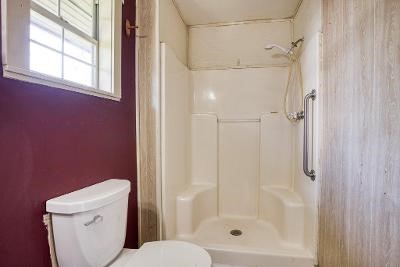 10733 Timbergrove Lane Corpus Christi, TX 78410 - Photo 36 of 40 a bathroom with a shower and a toilet