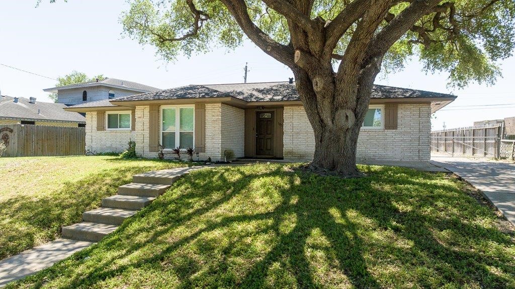 10733 Timbergrove Lane Corpus Christi, TX 78410 - Photo 40 of 40 a front view of a house with a yard