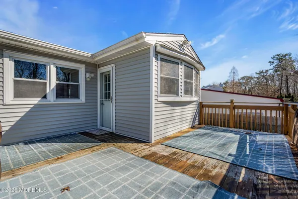 a view of a house with wooden fence