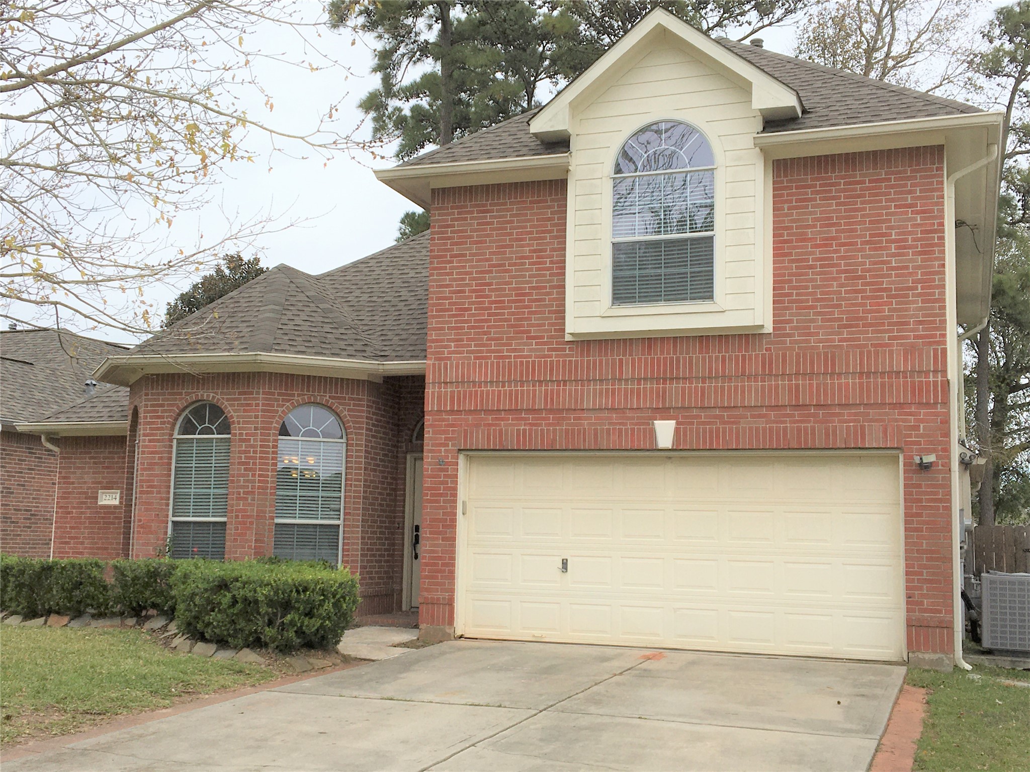 a front view of a house with garage