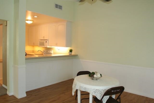 2118 Ridgeview Place Escondido, CA 92026 - Photo 12 of 25 Just off the kitchen could be a breakfast area and or a main dining area. Please note the Corian counter top is designed for stools and an eat-at counter.