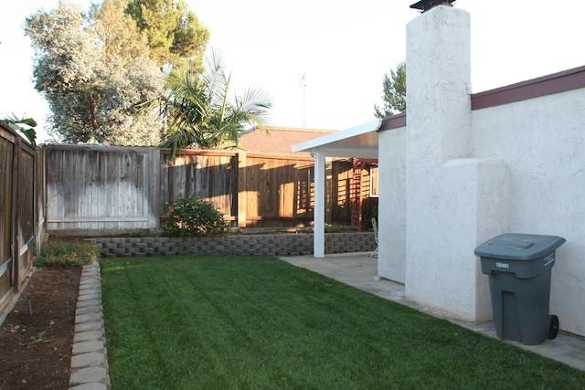 2118 Ridgeview Place Escondido, CA 92026 - Photo 3 of 25 Looking south in the private backyard or one could go to one of the two pools, play equipment, ball park or use the walking trails -- all within an easy walk from the property.