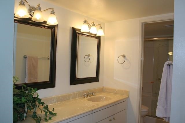 2118 Ridgeview Place Escondido, CA 92026 - Photo 8 of 25 Master bath has been completely remodeled with a large step-in shower, tempered sliding doors, Toto toilet and flooring.