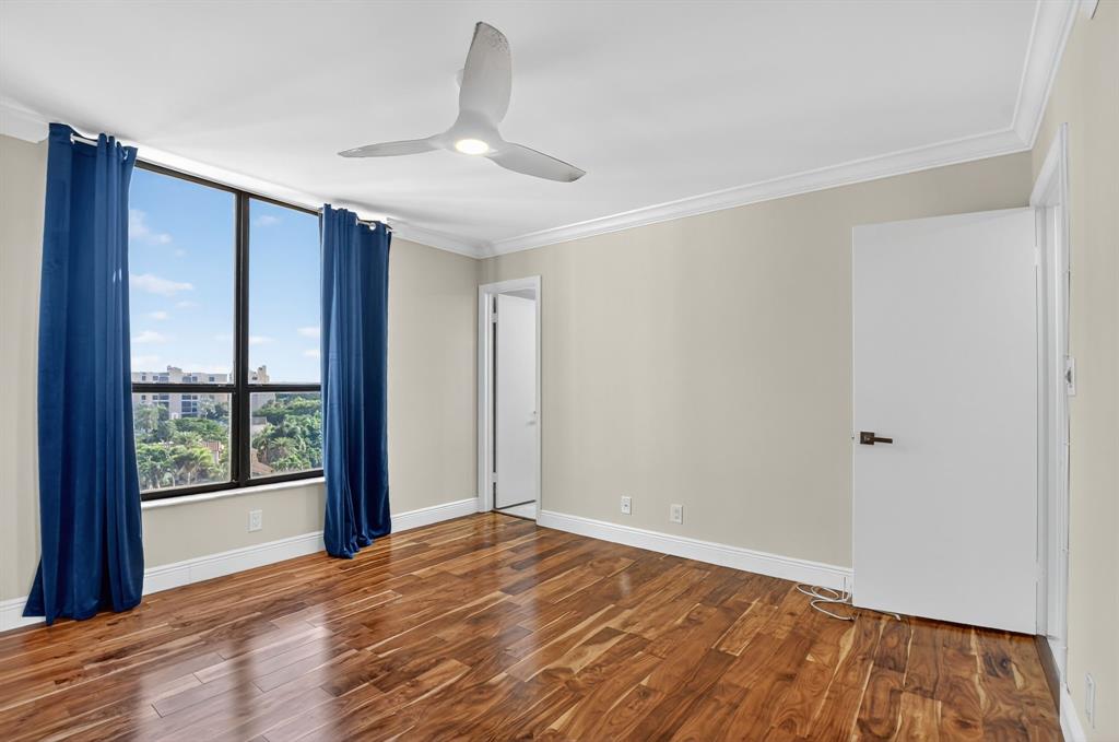 7145 Promenade Drive, Unit C702 Boca Raton, FL 33433 - Photo 41 of 82 a view of an empty room with wooden floor and a window