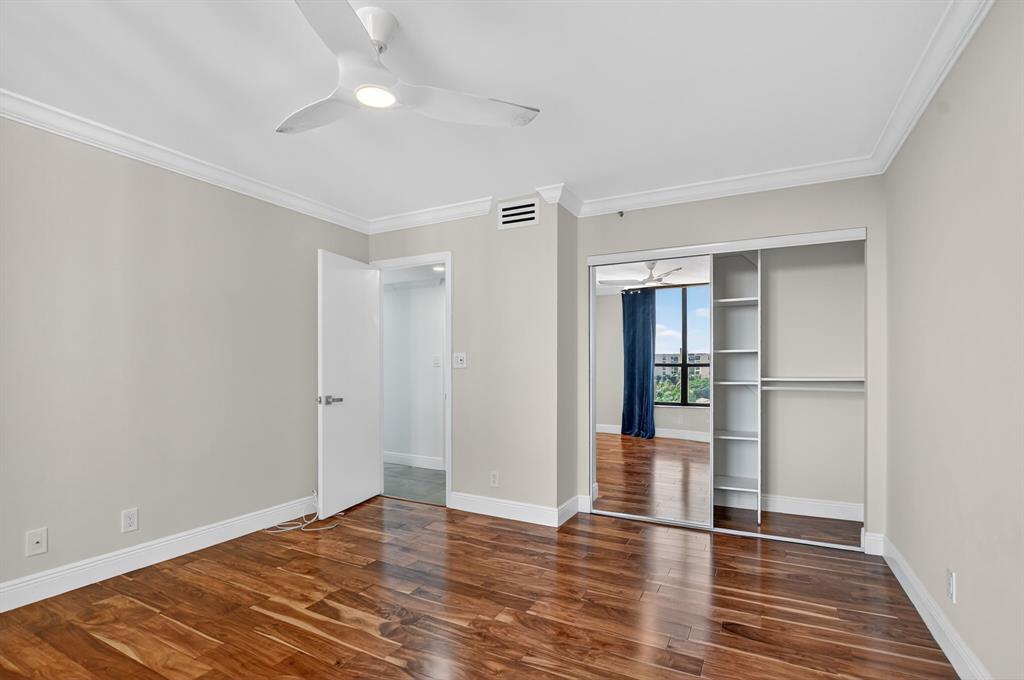 7145 Promenade Drive, Unit C702 Boca Raton, FL 33433 - Photo 42 of 82 a view of an empty room with wooden floor