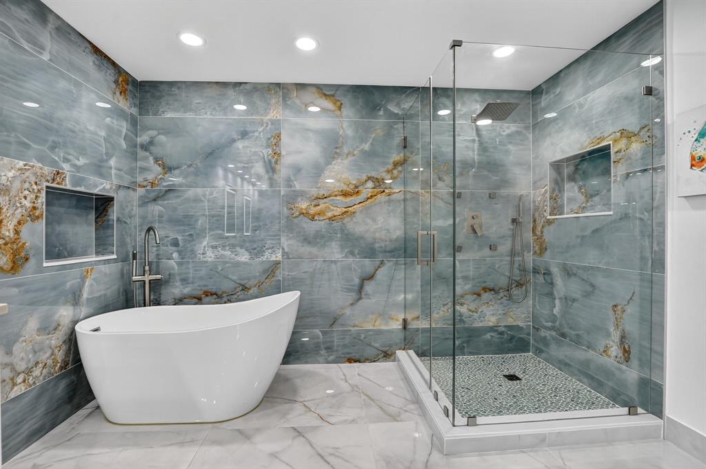 7145 Promenade Drive, Unit C702 Boca Raton, FL 33433 - Photo 50 of 82 a bathroom with a bathtub and shower