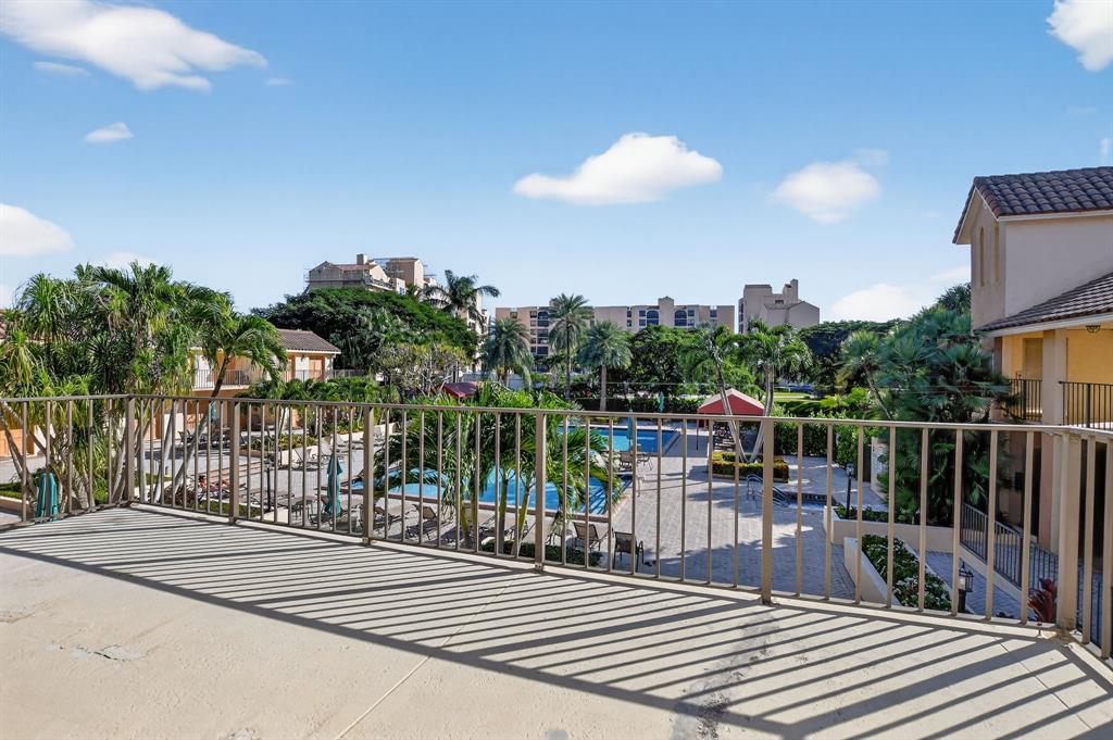 7145 Promenade Drive, Unit C702 Boca Raton, FL 33433 - Photo 75 of 82 a view of a balcony with wooden floor