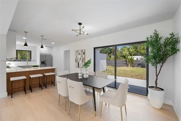 a view of a dining room with furniture window and outside view