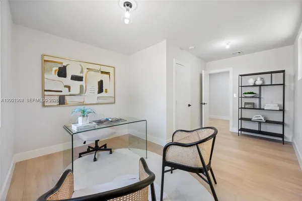 a view of a workspace with furniture