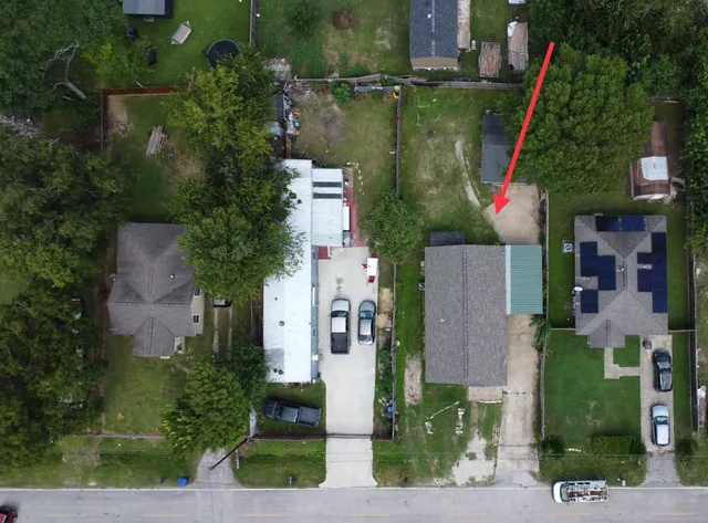 an aerial view of houses and roads