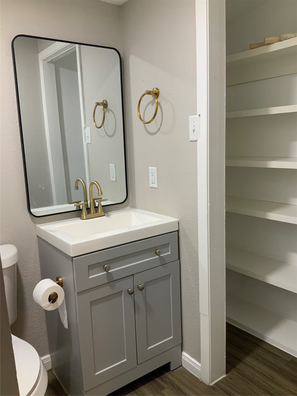 2415 Perry Street Baytown, TX 77521 - Photo 25 of 28 a bathroom with a sink and mirror with toilet
