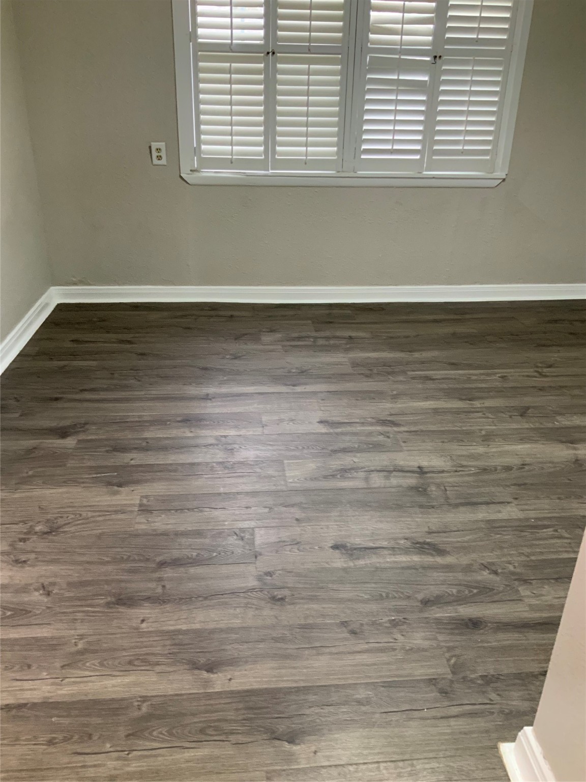 2415 Perry Street Baytown, TX 77521 - Photo 6 of 28 a view of a room with wooden floor and a window