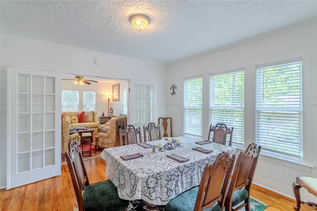 a view of a dining room with furniture window and outside view