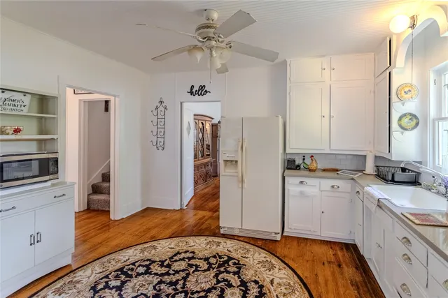 a kitchen with a sink stove and refrigerator