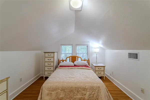 a bed room with a bed and a window