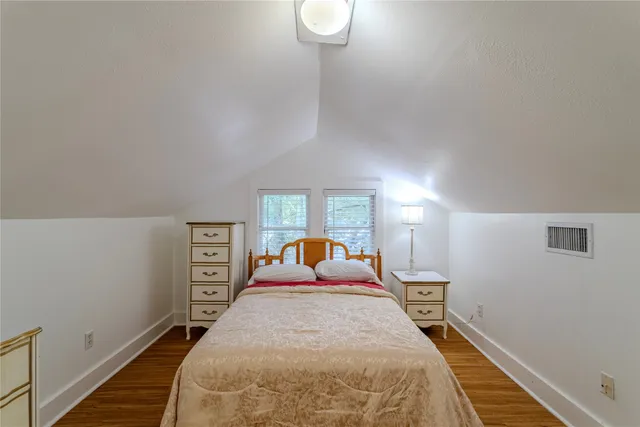 a bed room with a bed and a window