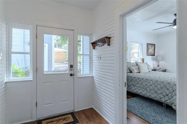 a bedroom with a bed and a window