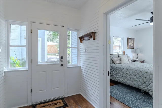 a bedroom with a bed and a window