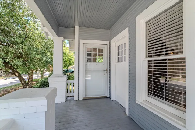 a view of livingroom with a door and wooden floor