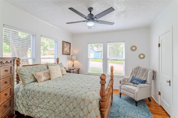 a bedroom with a large bed and a couch