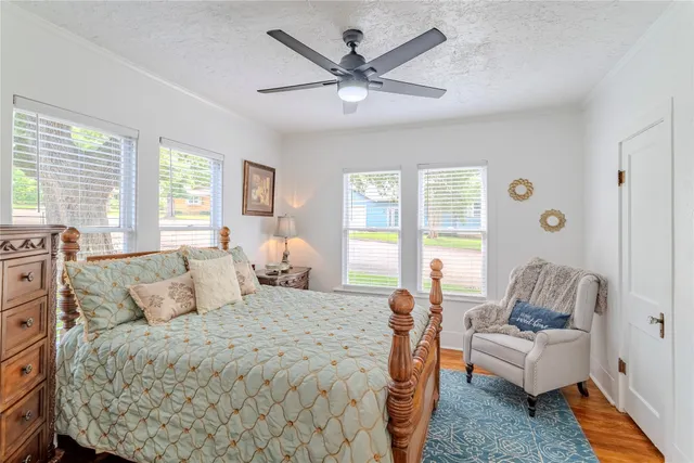 a bedroom with a large bed and a couch