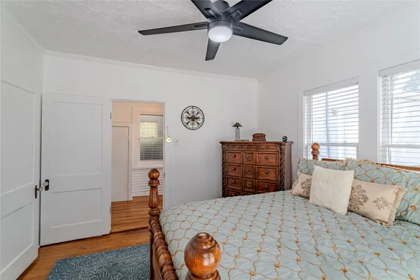 a bedroom with a bed and a dresser in it