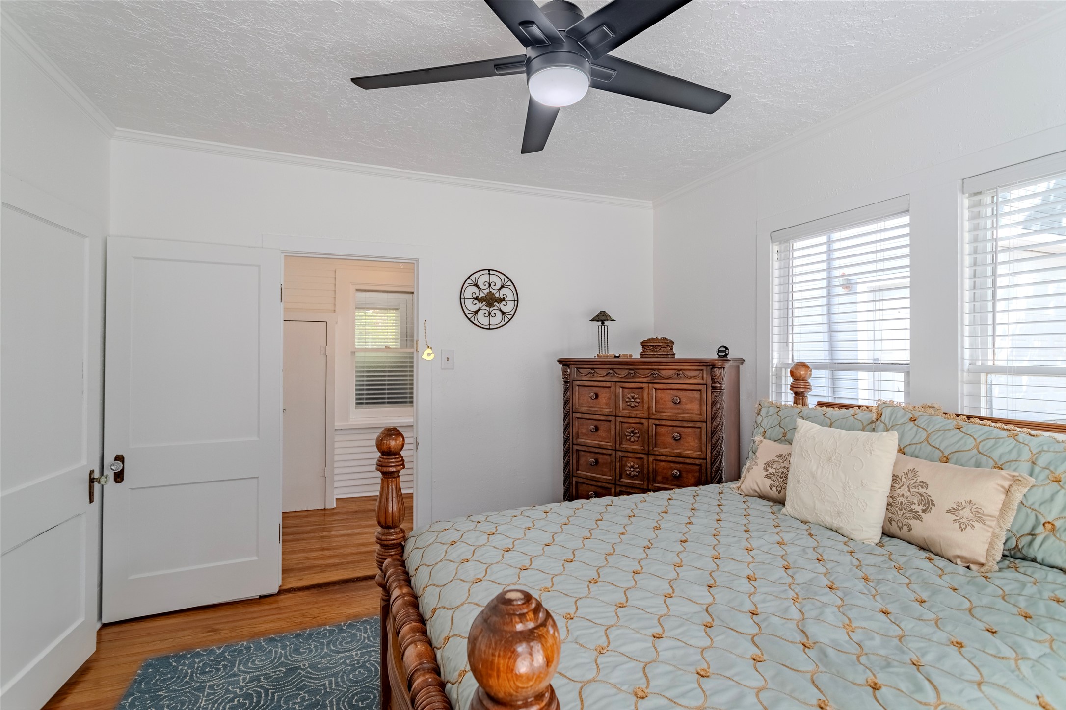 1707 South Day Street Brenham, TX 77833 - Photo 7 of 23 a bedroom with a bed and a dresser in it