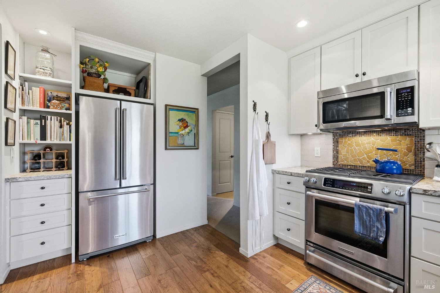 96 Aspen Meadows Circle Santa Rosa, CA 95409 - Photo 20 of 46 a kitchen with stainless steel appliances white cabinets and wooden floor