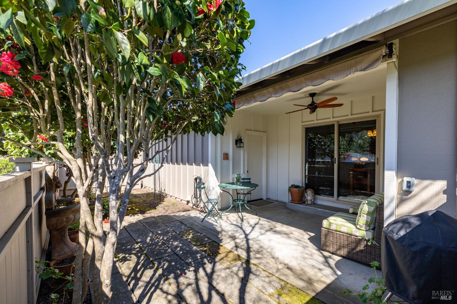 96 Aspen Meadows Circle Santa Rosa, CA 95409 - Photo 38 of 46 a view of backyard with a table and chairs and potted plants