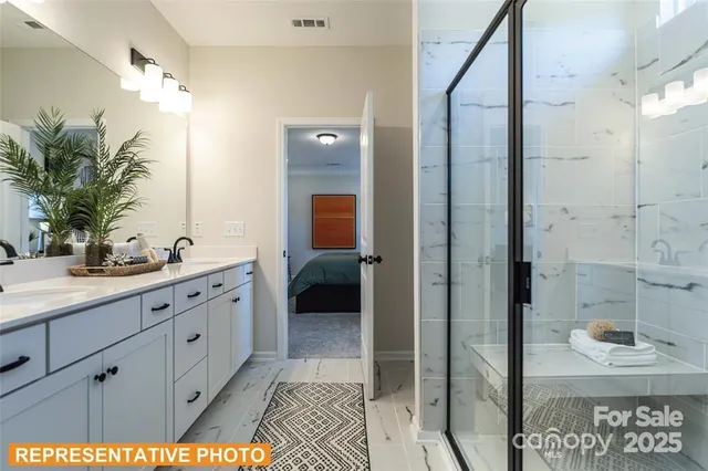 a spacious bathroom with a shower and a sink