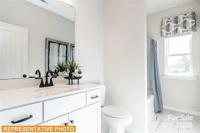 a view of a utility room with dryer and washer