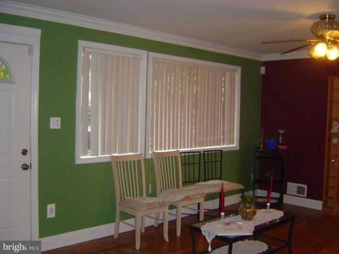 13021 Matey Road Silver Spring, MD 20906 - Photo 2 of 27 a view of a room that has a bed and a table in it