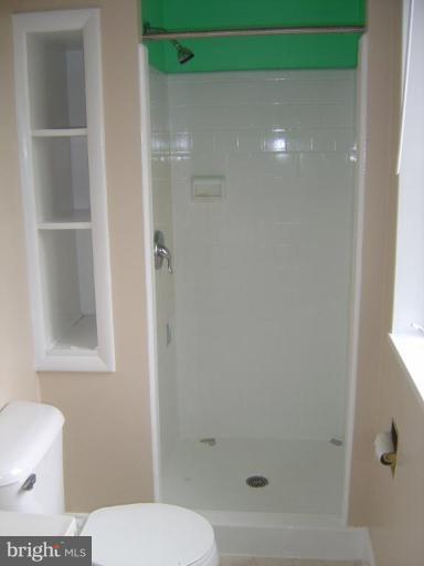 13021 Matey Road Silver Spring, MD 20906 - Photo 10 of 27 a bathroom with a toilet and a shower