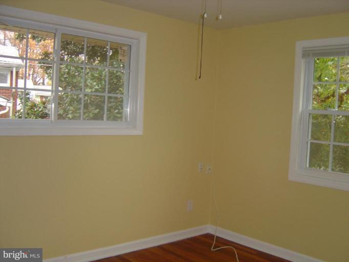 13021 Matey Road Silver Spring, MD 20906 - Photo 12 of 27 a view of a small space with wooden floor and a window