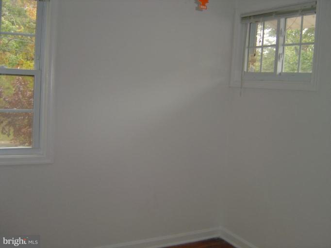 13021 Matey Road Silver Spring, MD 20906 - Photo 13 of 27 an empty room with windows