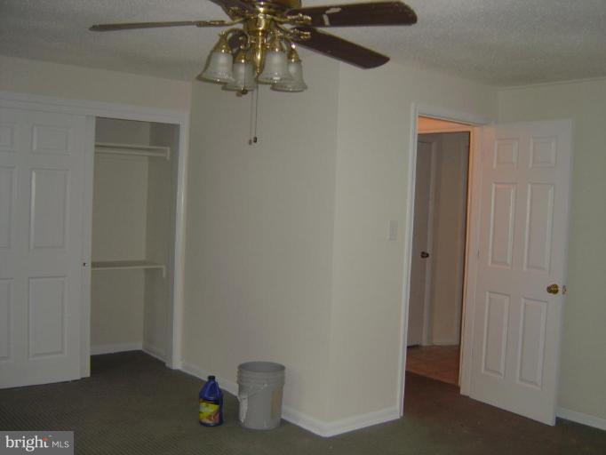 13021 Matey Road Silver Spring, MD 20906 - Photo 15 of 27 a view of an empty room and chandelier fan