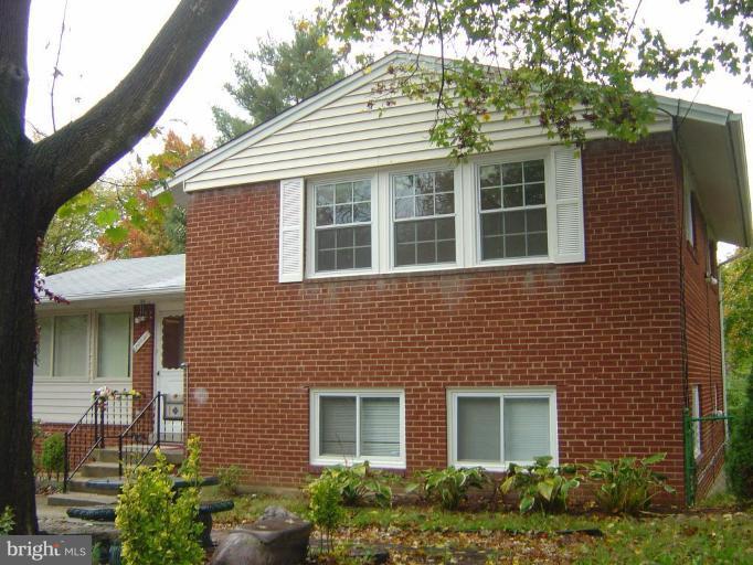 13021 Matey Road Silver Spring, MD 20906 - Photo 20 of 27 a view of a house with brick walls and potted plants