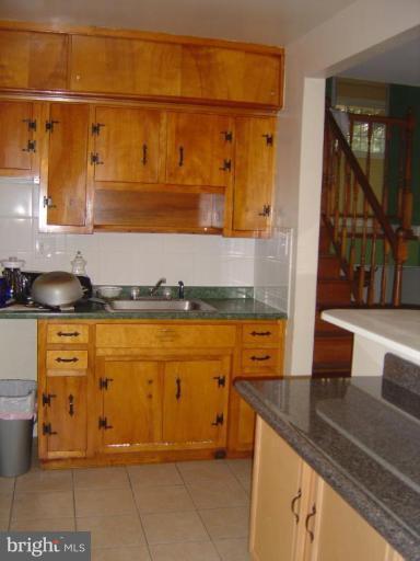 13021 Matey Road Silver Spring, MD 20906 - Photo 4 of 27 a view of a kitchen with granite countertop cabinets