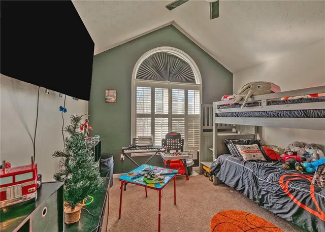a bedroom with furniture and a potted plant