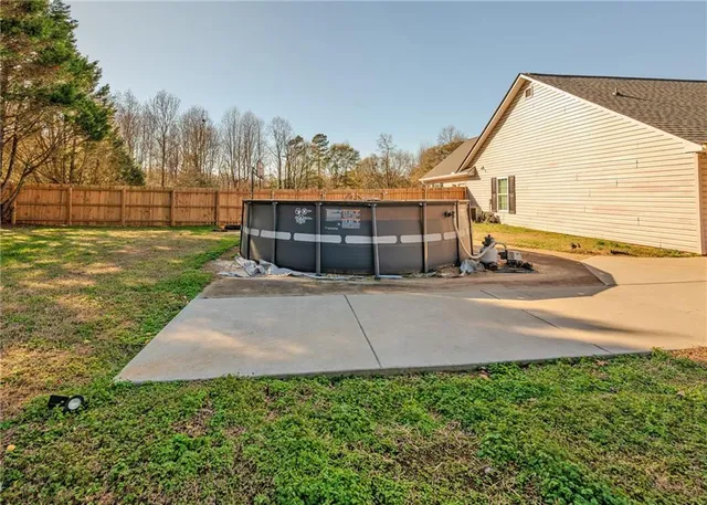 a view of a backyard of the house