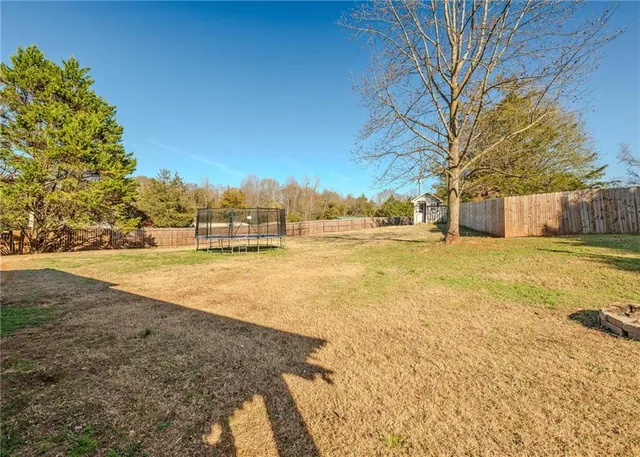 a view of pool of water with palm trees