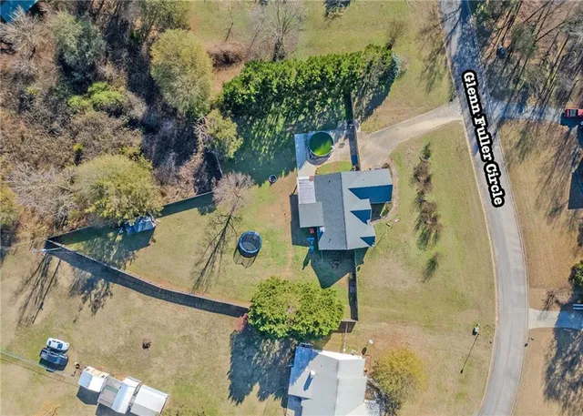 aerial view of a house with a yard