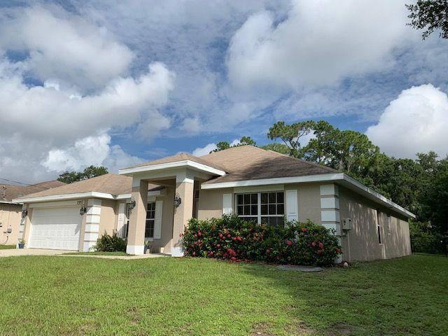 1557 Southwest Fortune Road Port St. Lucie, FL 34953 - Photo 2 of 29 FRONT YARD
