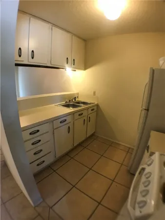 a view of cabinets and wooden floor