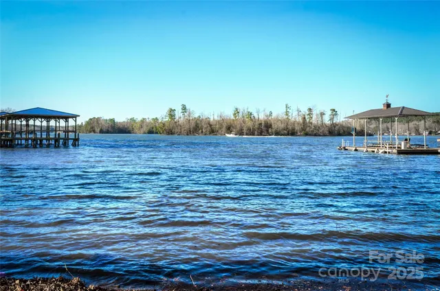 a view of a lake with a yard