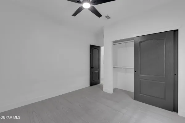 a bathroom with a sink toilet vanity and shower
