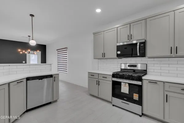 a view of a livingroom with a ceiling fan and window