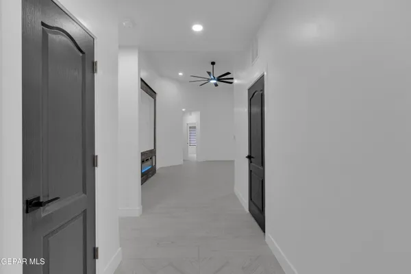 a view of an empty room and fire place