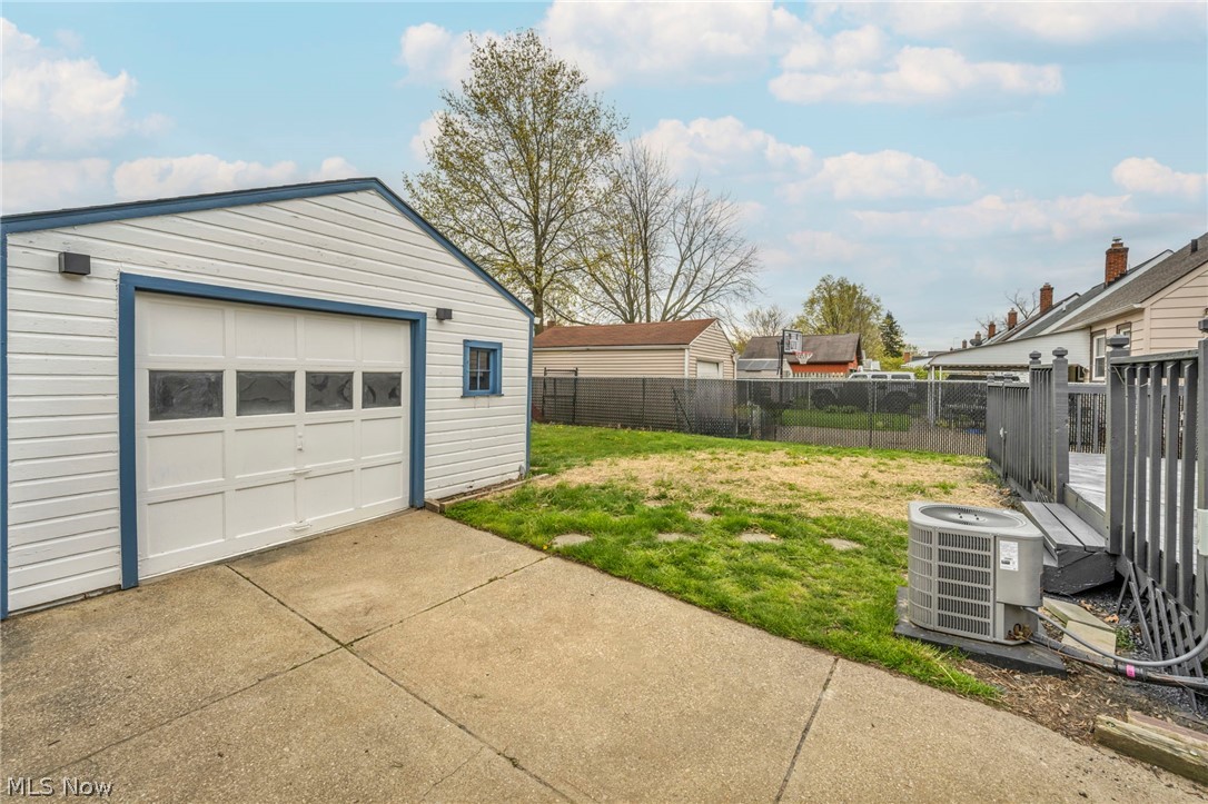 1609 Mapledale Road Wickliffe, OH 44092 - Photo 36 of 46 Garage with central air condition unit and a lawn